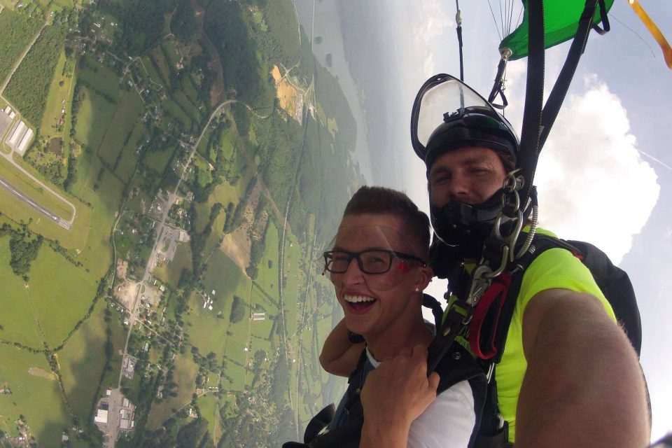 Male skydiver under canopy with Chattanooga Skydiving Company tandem instructor