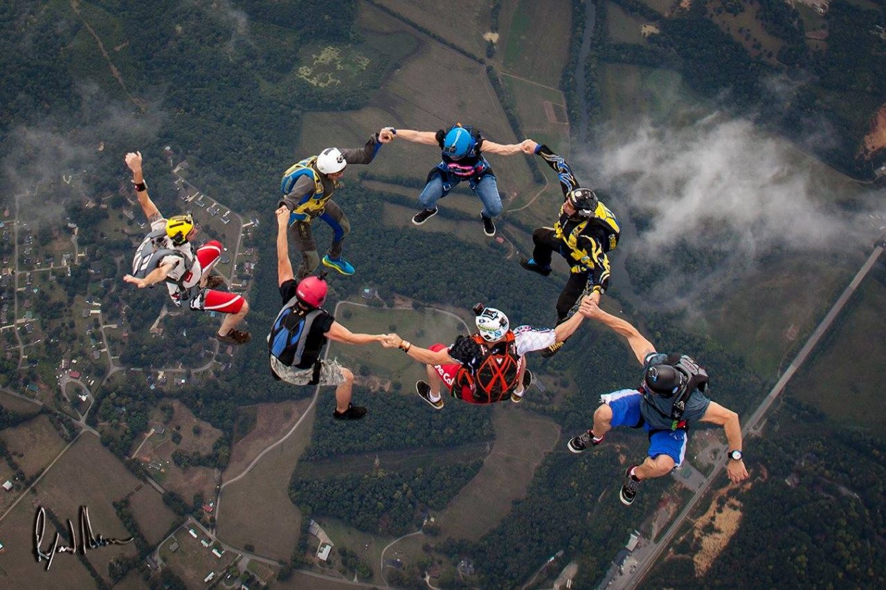 Experienced skydivers in a sit formation during free fall at Chattanooga Skydiving Company