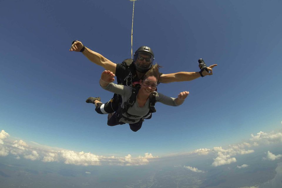 Women holding her arms out during her skydive at Chattanooga Skydiving Company